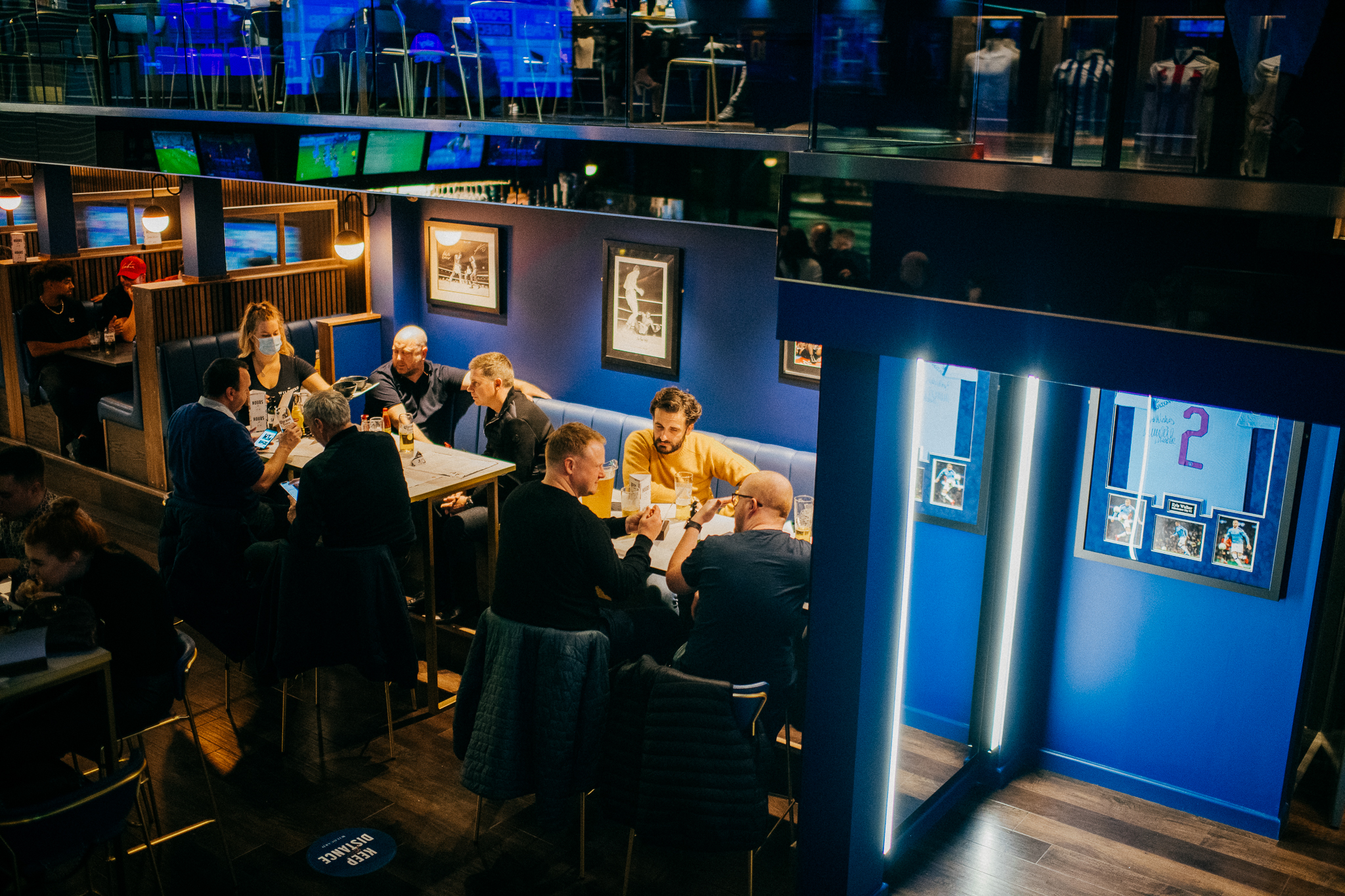 People eating at tables at The Wildcard Bar & Grill.