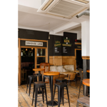 Several tall tables with bar stools at The Gin Bar.