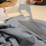 Close up of people sewing