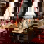 Conference room setup with paper, pens, and water bottles on the table.