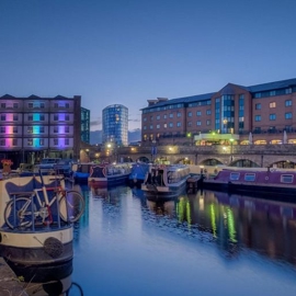 The exterior of the Best Western Quays Hotel shot at dusk.