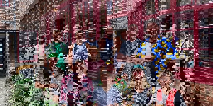 A group of people posing for a photo outside Hop Hideout in Sheffield.