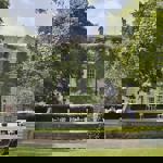 Historic Aston Hall Hotel set among mature trees and well-maintained grounds.