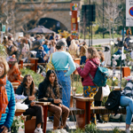 A crowd of people at the outdoor Pollen Market in Sheffield city centre.