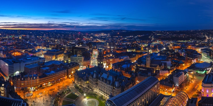 A panorama shot of the Sheffield skyline at night.