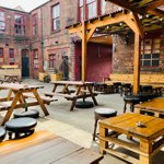 The courtyard at Yellow Arch, with tables and chairs.