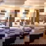 A hotel room with two beds.