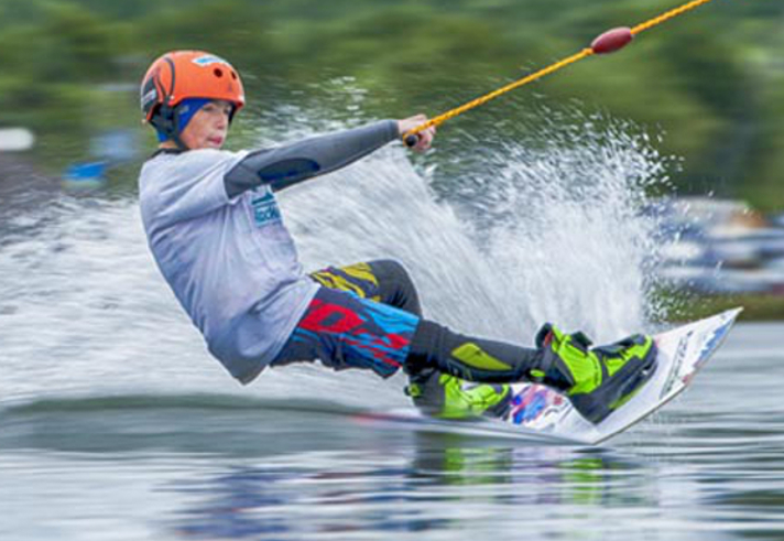 A person water skiing on a lake.