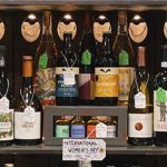 A shelf with various bottles of spirits.