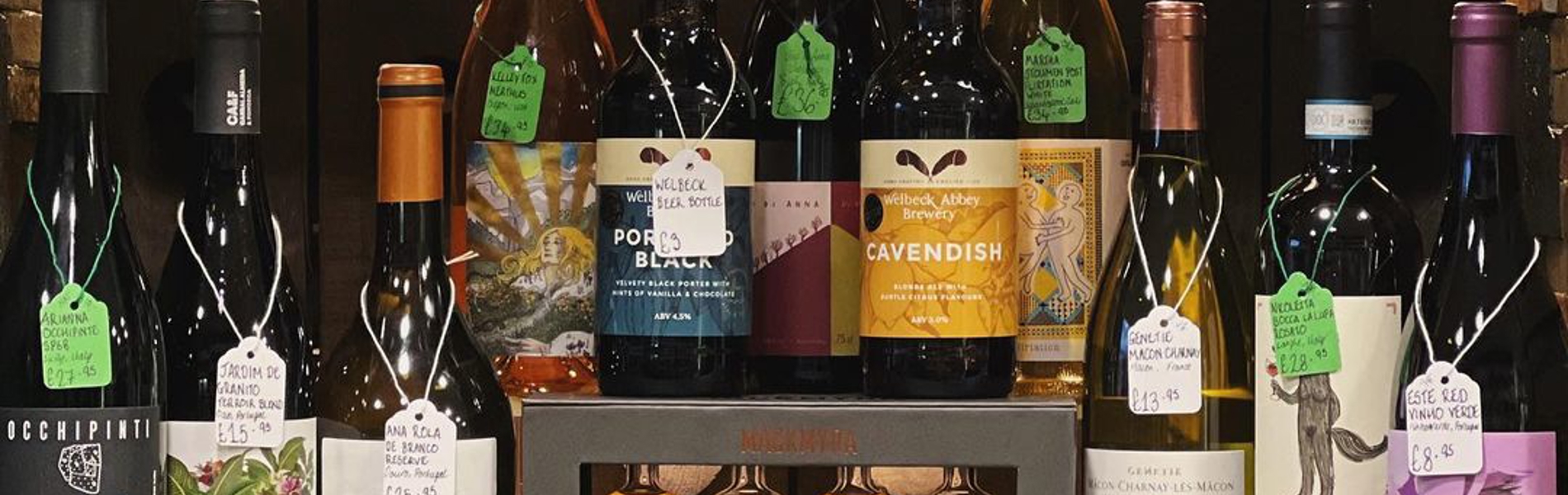 A shelf with various bottles of spirits.