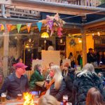 The courtyard at Hagglers Corner, filled with people celebrating.