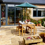 Front of Finkle Green Bed and Breakfast with outdoor seating, pathway, and greenery