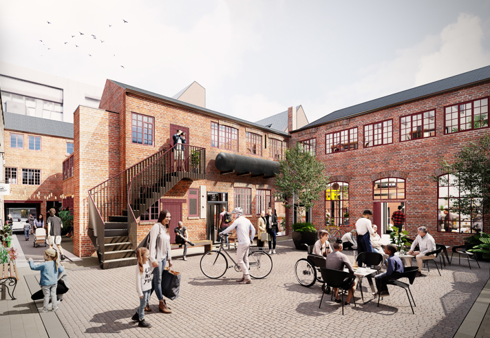 CGI-rendered courtyard scene with red-brick buildings featuring large windows and outdoor staircases. People are walking, cycling, and sitting at black tables enjoying food and drinks. There are potted trees and signage for shops, creating a lively, modern communal space.