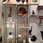 A display case filled with small pieces at Cupola Gallery.
